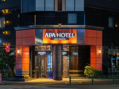 a building with an apr hotel sign on it at APA Hotel Higashi Shinjuku Kabukicho Higashi in Tokyo