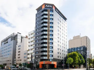a building with an acm sign on the top of it at APA Hotel Higashi Shinjuku Kabukicho Higashi in Tokyo