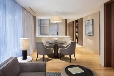 a living room with a couch and a table and chairs at Ascott Marunouchi Tokyo in Tokyo