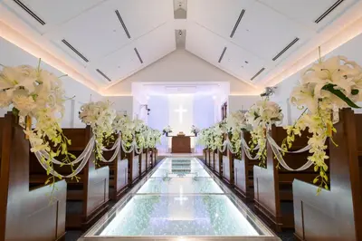 a wedding aisle with flowers in a church at Bayside Hotel Azur Takeshiba in Tokyo