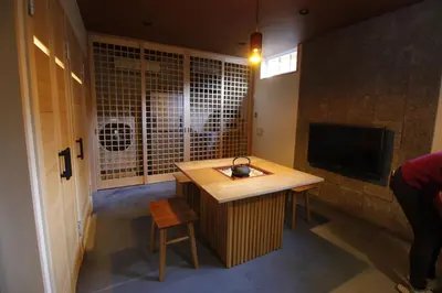 a room with a desk and a tv in a room at Yanaka Kotobuki Sou in Tokyo