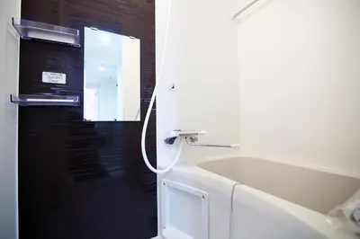 a bathroom with a shower and a tub and a sink at The Sorapia Tokyo in Tokyo