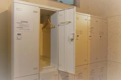 a row of lockers sitting next to each other at obi Hostel in Tokyo