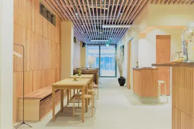 a dining room with a table and chairs at obi Hostel in Tokyo
