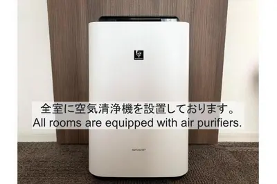a white refrigerator with a sign on it at Henn na Hotel Maihama Tokyo Bay in Urayasu