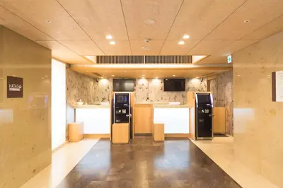 a room with two vending machines in a building at Dormy Inn Premium Kanda in Tokyo