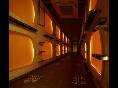 an empty hallway of a train with windows at Do-c Shibuya Ebisu in Tokyo