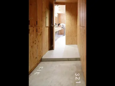 a hallway with numbers on the floor of a house at Do-C Gotanda in Tokyo