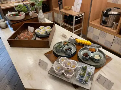a kitchen counter with plates of food on it at Rembrandt Style Tokyo Nishikasai Grande in Tokyo