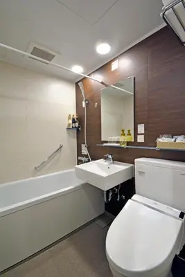 a bathroom with a toilet and a sink and a tub at Rembrandt Style Tokyo Nishikasai Grande in Tokyo