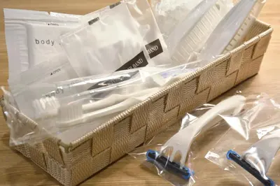a plastic basket with utensils in it on a table at Rembrandt Style Tokyo Nishikasai Grande in Tokyo
