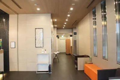 a hallway of a hospital with a waiting room at Rembrandt Style Tokyo Nishikasai Grande in Tokyo