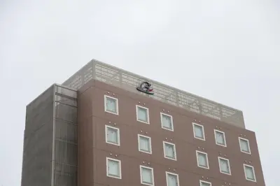 a building with a person on the top of it at Rembrandt Style Tokyo Nishikasai Grande in Tokyo