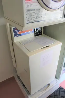 a refrigerator with its door open in a room at Hotel Sunroute Stellar Ueno in Tokyo