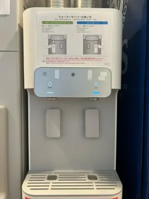 a white refrigerator with a box on top of it at Hotel Sunroute Stellar Ueno in Tokyo