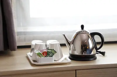 a tea kettle sitting on top of a table at Hotel Sunroute Stellar Ueno in Tokyo
