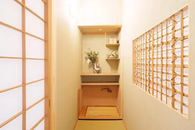 a hallway with a door leading into a room at PREMIER suite Shinjuku West 3F 4F in Tokyo