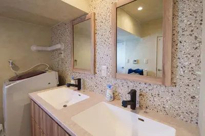 a bathroom with a sink and a mirror at PREMIER suite Shinjuku West 3F 4F in Tokyo