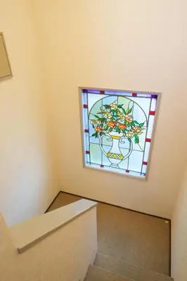 a room with a stained glass window on the wall at PREMIER suite Shinjuku West 3F 4F in Tokyo