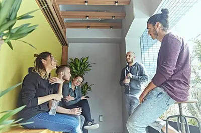 a group of people sitting in a room at Wise Owl Hostels Shibuya in Tokyo