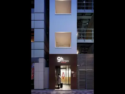 a man walks through the entrance to a building at 9h nine hours woman Kanda in Tokyo