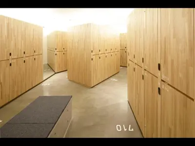 a row of wooden lockers in a gym at 9h nine hours woman Kanda in Tokyo