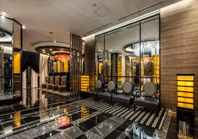 a dressing room with a bunch of chairs and mirrors at APA Hotel Asakusa Tawaramachi Ekimae in Tokyo