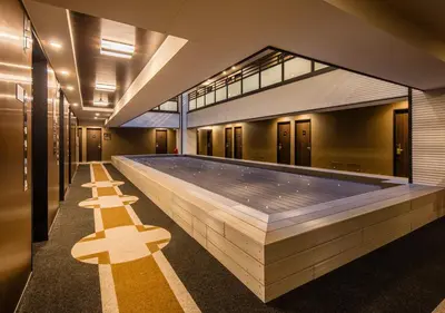a swimming pool in the middle of a building at APA Hotel Asakusa Tawaramachi Ekimae in Tokyo