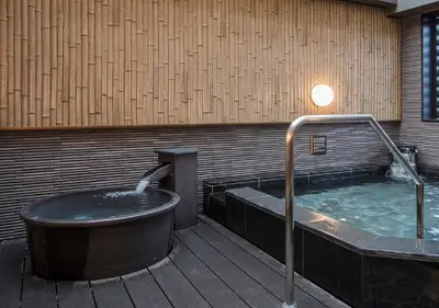 a large hot tub sitting on a deck with at APA Hotel Asakusa Tawaramachi Ekimae in Tokyo