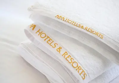 a stack of white towels with the words mattress inspections on them at APA Hotel Asakusa Tawaramachi Ekimae in Tokyo