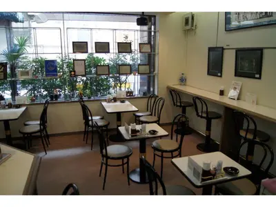 a dining room with tables and chairs in a restaurant at Nishishinjuku Green Hotel in Tokyo