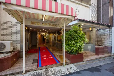 a red carpet in the front of a store at Hotel Suntargas Otsuka in Tokyo