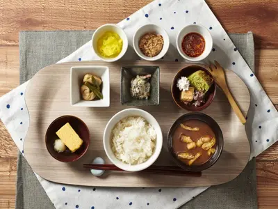 a tray of food with bowls of food on a table at Keio Presso Inn Tokyo Station Yaesu in Tokyo