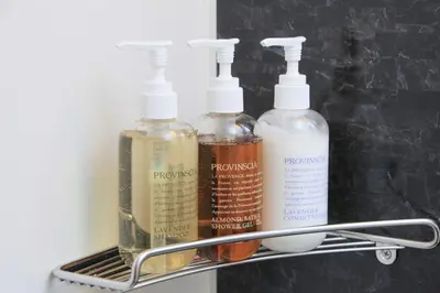 a shelf with three bottles of alcohol on it at Center Hotel Tokyo in Tokyo