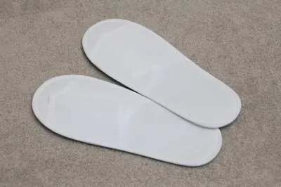 a pair of white shoes sitting on the floor at Center Hotel Tokyo in Tokyo