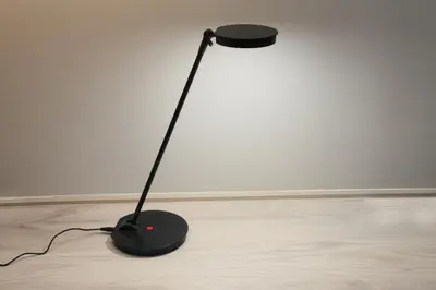 a black lamp sitting on top of a wooden floor at Center Hotel Tokyo in Tokyo