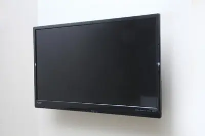 a flat screen tv hanging on a wall at Center Hotel Tokyo in Tokyo