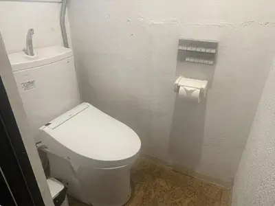 a small bathroom with a toilet and a sink at Little Japan in Tokyo