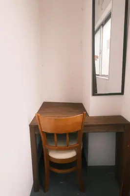 a wooden desk with a chair and a mirror at Little Japan in Tokyo
