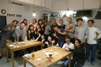 a group of people posing for a picture in a room at Little Japan in Tokyo
