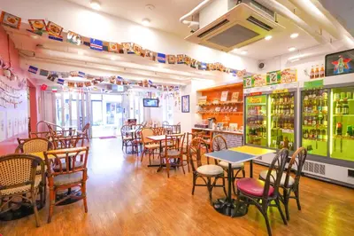 a restaurant with tables and chairs in a room at Sakura Hotel Nippori in Tokyo