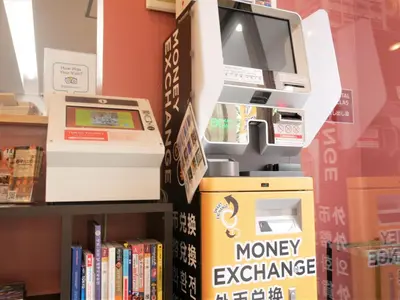 an money exchange machine in a store with books at Sakura Hotel Nippori in Tokyo