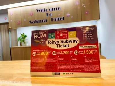 a sign sitting on top of a table at Sakura Hotel Nippori in Tokyo