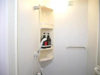 a refrigerator with two bottles of wine in it at Sakura Hotel Nippori in Tokyo