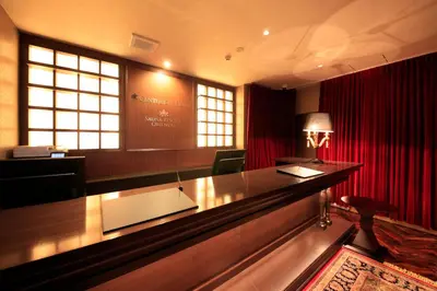 a courtroom with a desk and red curtains at Centurion Hotel&Spa Ueno Station in Tokyo