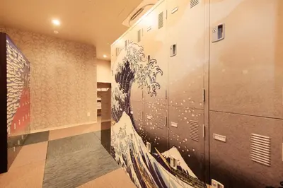 a room with a wall with a painting on it at Centurion Hotel&Spa Ueno Station in Tokyo