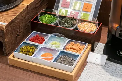 a wooden box with different types of food in it at Shibuya Excel Hotel Tokyu in Tokyo