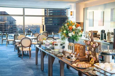 a buffet of food on a table in a room at Shibuya Excel Hotel Tokyu in Tokyo