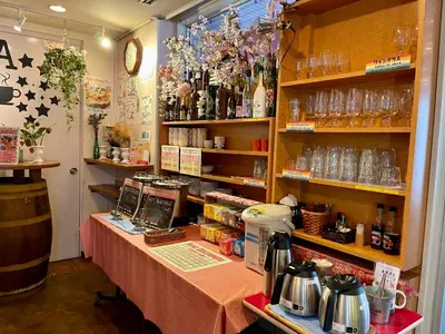 a room with a table with a counter with a table sidx sidx at Sakura Hotel Ikebukuro in Tokyo