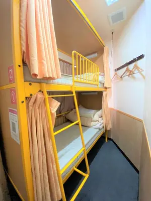 a bunk bed in a room with a bunk bed in a room at Sakura Hotel Ikebukuro in Tokyo